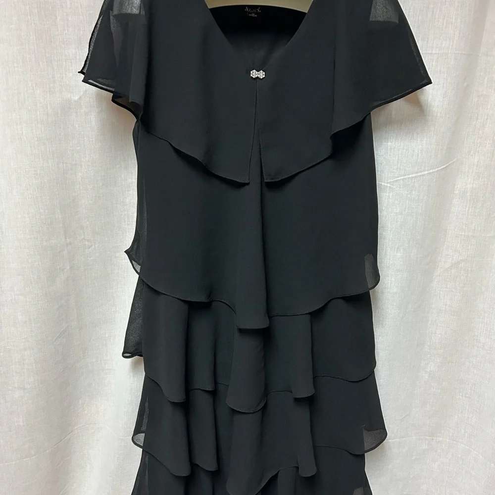 Black tiered sassy dress 
Cruise 
Hem 40” 23” armpit to armpit flat 
Size 18 - Picture 3 of 13